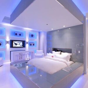 Premium twin room with modern lighting and storage.
