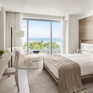Deluxe room featuring luxury linens and minibar.